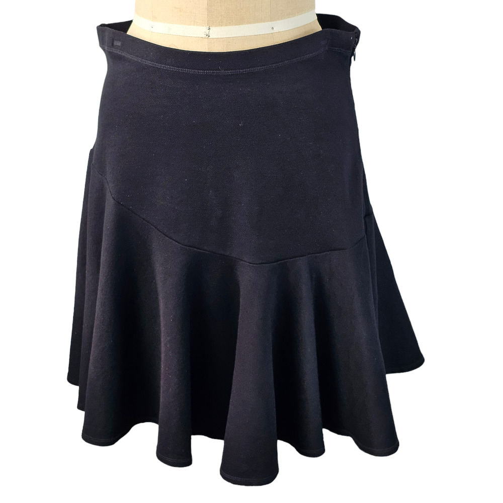 Cabi black ponti skirt with flared asymmetrical peplum size 10